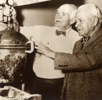 Lee de Forest with unidentified man, in front of pressure gauge