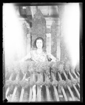 Woman with Fiesta de las Rosas parade float frame