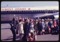 Northwest Orient plane with group waving