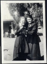 Two young women in school uniform