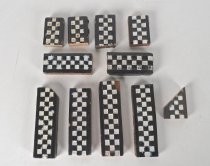 (11) black and white checkerboard style border tiles and tile fragments