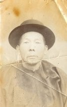 Chinese Man Wearing Hat and Traditional Chinese Clothes