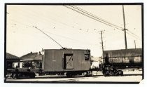 Electric railway locomotive and tank car