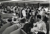 Men working Motorola assembly line