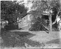 Bungalow under oak trees, c. 1912