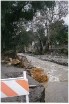 Severe flood waters with road washed away