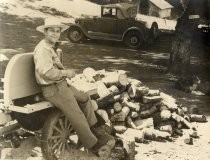 Hugh Stuart Center outdoors with pile of chopped wood