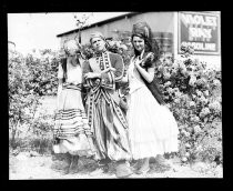 Group of three in Fiesta de las Rosas costumes