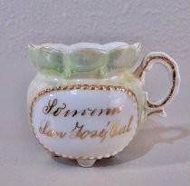 Green souvenir cream pitcher