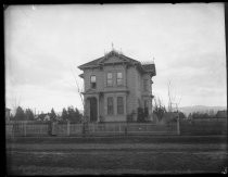 Woman and child outside house with rooms to let