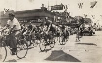 Bicycle riders in parade on city street