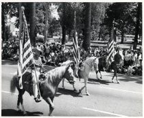 Parade with Esquestrians and American Flags