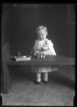 Portrait of toddler playing with blocks