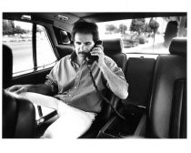 Jim Coglianese using carphone in his Rolls-Royce