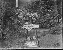 Flower bouquets on table outside, c. 1912