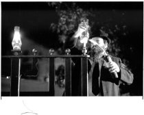 Rabbi Yosef Levin lights the menorah at Lytton Square