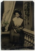 Portrait of young woman with floral hat