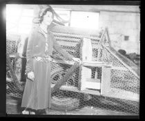 Woman with chicken wire frame of Fiesta parade float