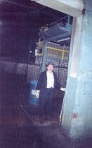 Nellie Mendoza in the warehouse at Del Monte Cannery Plant 3