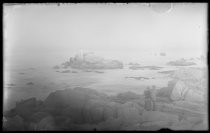 Couple standing on rocks at Pacific Grove