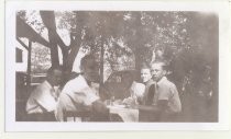 Glenn Eubanks and newspaper carriers having a picnic