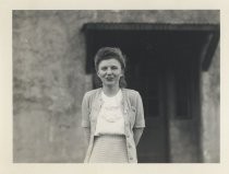 Ruby Levin posing in front of concrete building