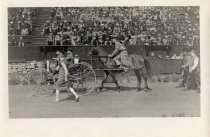 Stanford students in costume with automobile and horse procession