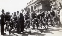 Group shot of bicycle racers at start of race, Joe Colla