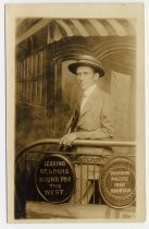 Irvin B. Fisher on back of railroad car