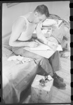 Soldier writing letters in his quarters