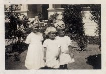 Three sisters with bows in their hair