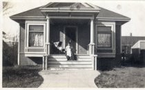 Ida Beall Sitting on Front Porch