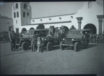 Civilians posing with military vehicles