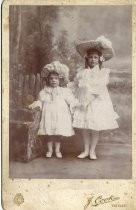 Two children in Easter bonnets