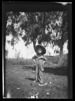 Evergreen Ranch photos - young child under bay trees