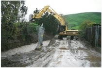 Bulldozer cleaning out flooded creek. 1998 El Nino Flood Berryessa Creek