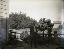 Man posing with an Ordinary Bicycle