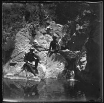 Men and women posing on rocks