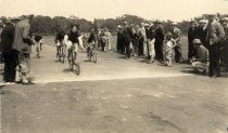 Bicycle racers on track with spectators