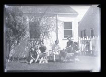 Five women meeting outside house