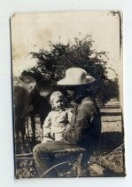 Wong Sing with infant on lap