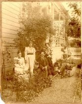 Family portraits outside Victorian home