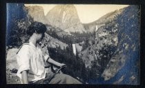 Woman posing on mountain rocks