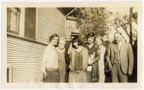 Salas family next to house