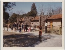 Crowd out side of llama pens at Happy Hollow Zoo, San Jose