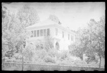 Two-story house with stone wall