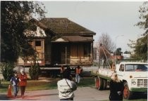 Hill House Moved Into Place with People in Front