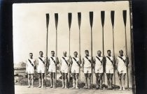 Stanford University rowing team posing with oars