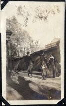 Students and nun stopping for a chat near wall