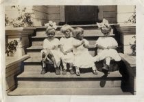 June, Carol and Liela Stumbles, seated on steps